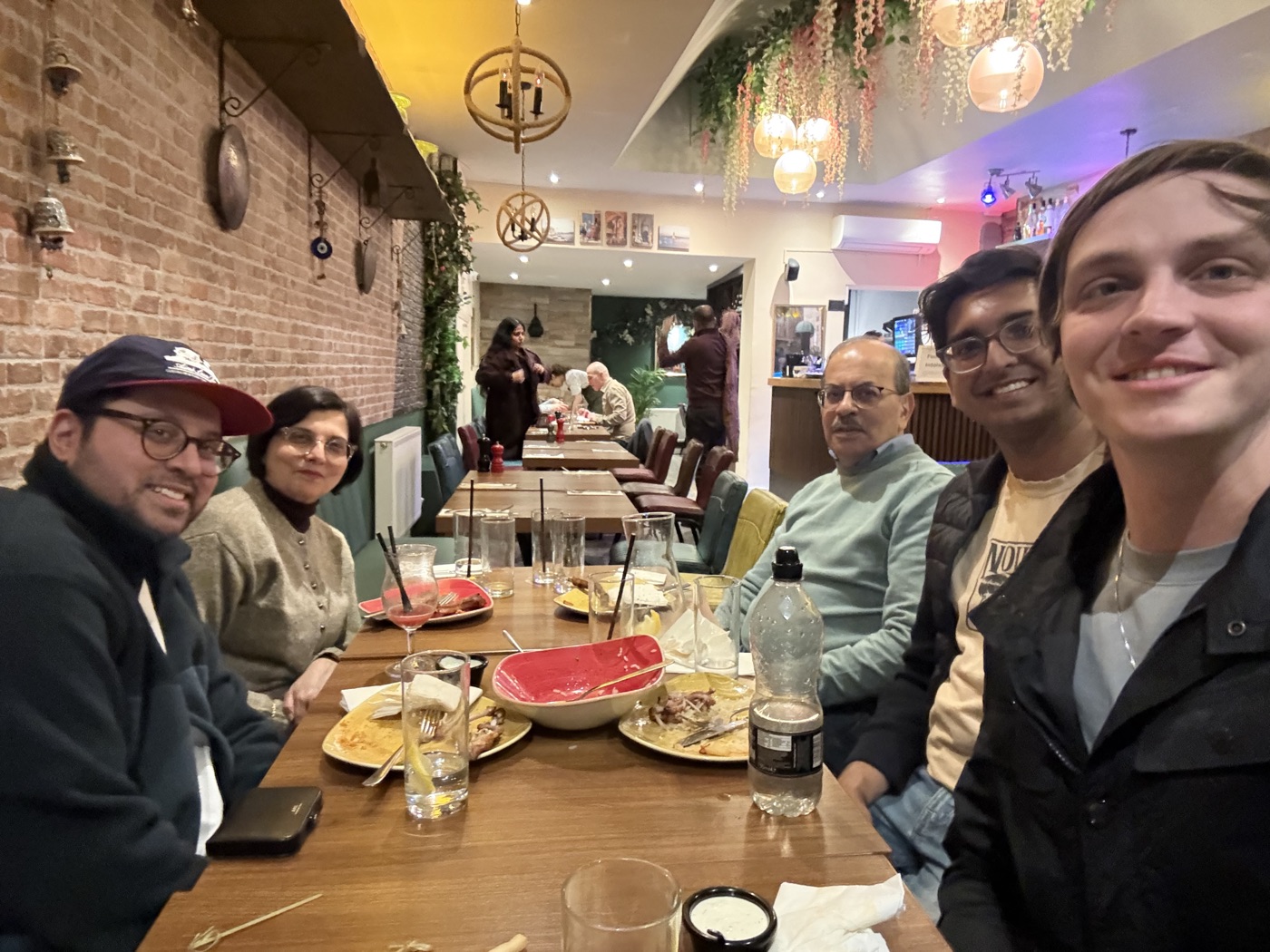 A family dinner selfie at a cozy restaurant